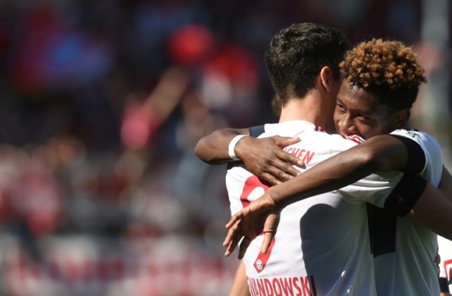 Bayern Munich's David Alaba (right) congratulates Robert Lewandowski after the Polish stri