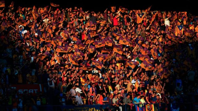 FC Barcelona fans wave flags before the Spanish "Copa del Rey" (King's Cup) final match FC