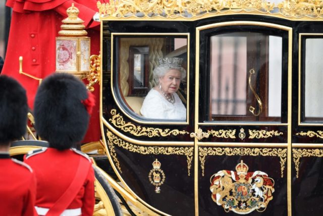Britain's Queen Elizabeth II travels to the Houses of Parliament in London on May 18, 2016