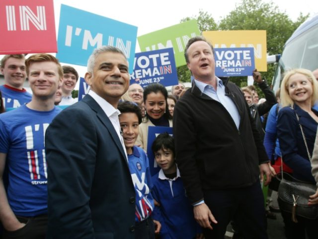 Prime Minister David Cameron (C) makes a joint appearance with the Mayor of London Sadiq K