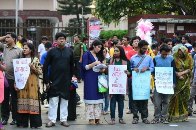 Protesters demonstrate against the killing of a university professor in Dhaka on April 29,