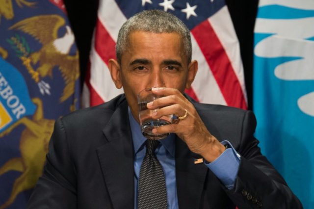 US President Barack Obama drinks filtered water during a meeting at the Food Bank of Easte
