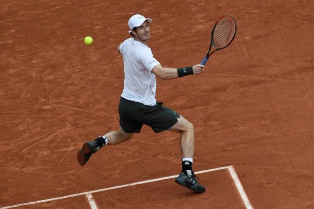 Britain's Andy Murray returns the ball to US player John Isner on May 29, 2016
