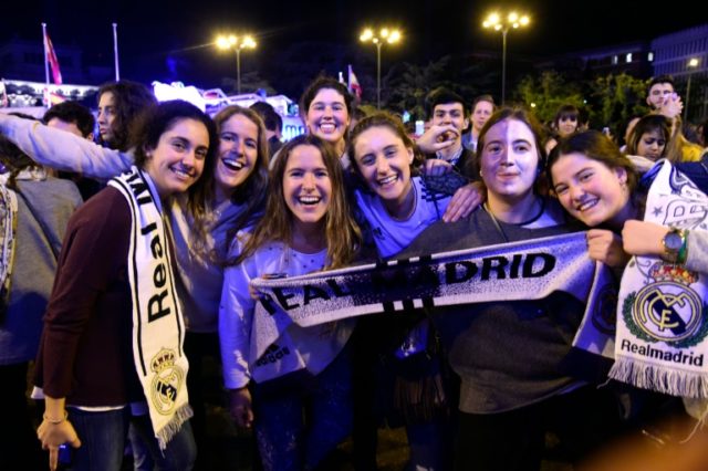 Real Madrid fans celebrate their team's UEFA Champions League win on the Plaza Cibeles in