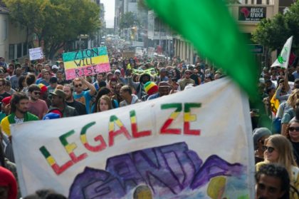 Thousands of people take part in a march through Cape Town, calling for the South African government to legalise marijuana, on May 7, 2016