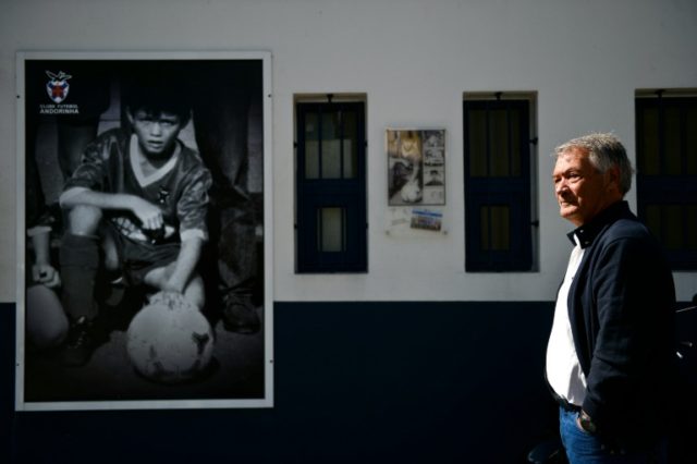 President of CF Andorinha Jose Bacelar, 67, stands next to a portrait of Cristiano Ronaldo