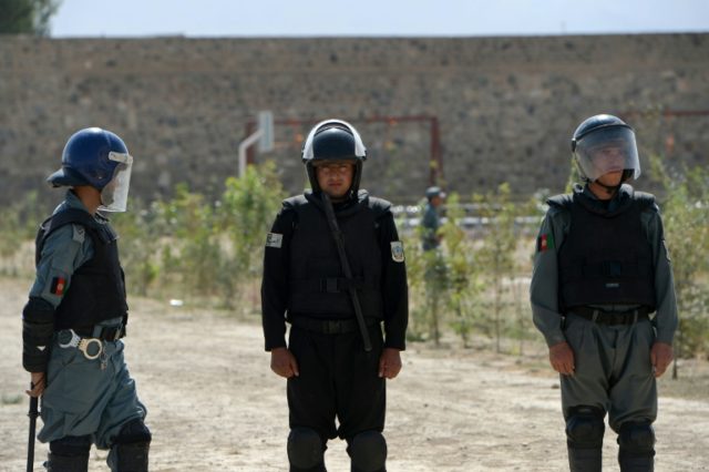 Afghan police keep watch at Pul-e-Charkhi prison, on the outskirts of Kabul, where five Af