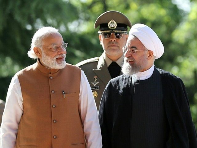 Iranian President Hassan Rouhani on May 23, 2016 shows him (right) walks alongside Indian