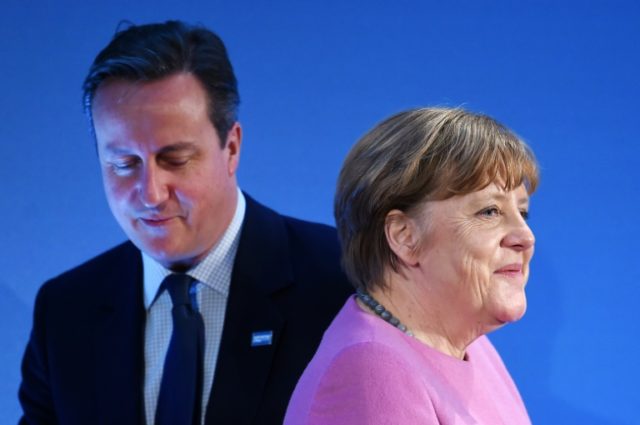 British Prime Minister David Cameron (L) and German Chancellor Angela Merkel, at a donor c