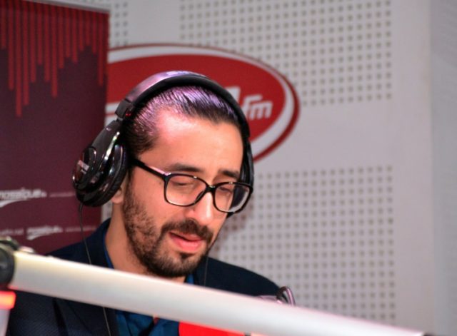 Tunisian comedian Migalo, whose real name is Wassim Lahrissi, records in the studios of th