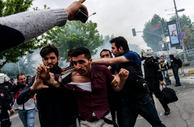Turkish anti-riot police detain a protester during clashes at a May Day rally in Bakirkoy,