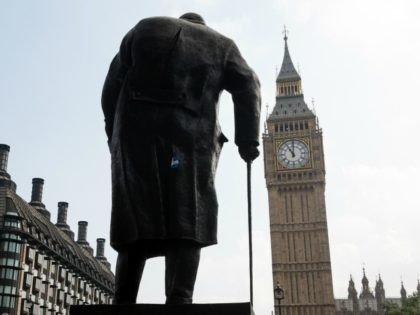 A statue of former British Prime Minster Winston Churchill faces the Houses of Parliament as the Great Clock strikes 11am, exactly 75 years after Britain's declaration of war against Germany and her involvement in World War II, on September 3, 2014 in London, England.