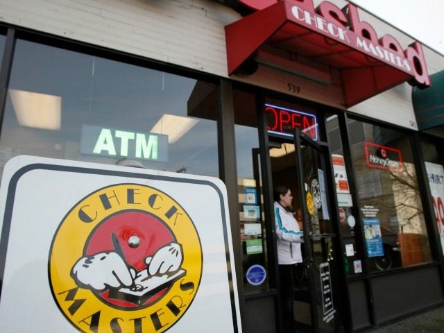 A customer walks out of a Check Masters payday lending store Monday, Dec. 28, 2009, in Sea