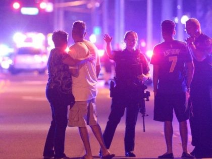 Orlando Police officers direct family members away from a fatal shooting at Pulse Orlando nightclub in Orlando, Fla. June 12, 2016.