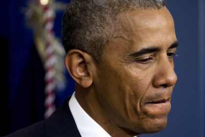 President Barack Obama pauses as he speaks in the White House briefing room in Washington,