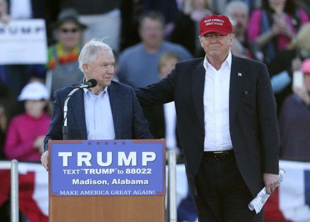 Republican presidential candidate Donald Trump, right, stands next to Sen. Jeff Sessions,