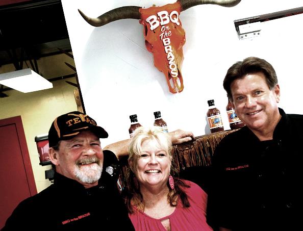 From left: Owners John and wife Kathryn Sanford and Michael Warren at BBQ on the Brazos in Cresson, Texas, in 2013. (Ron Jenkins/Fort Worth Star-Telegram/TNS via Getty Images)