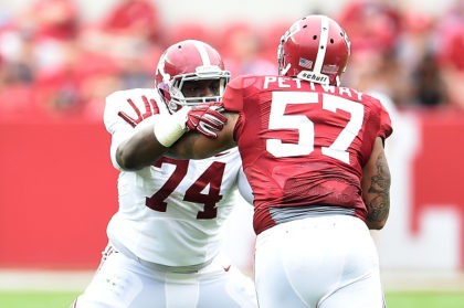 TUSCALOOSA, AL - APRIL 18: Cam Robinson #74 of the White team works against D.J. Pettway