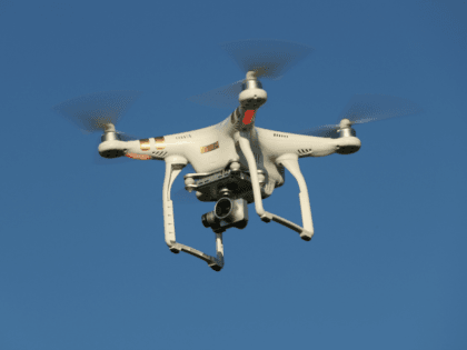 The photographer's DJI Phantom 3 Pro multirotor drone flies on …