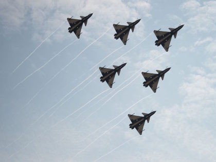 J-10 fighter jets of the Bayi Aerobatic Team of PLA's (Peoples Liberation Army) Air Force perform during a flight at the Airshow China 2014 in Zhuhai, south China's Guangdong province on November 11, 2014. Global aviation firms flocked to China on November 11 to show off their wares as economic …