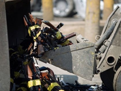 RANCHO CUCAMONGA, CA - JUNE 26: Tractors scoop up guns during the destruction of approximately 3,400 guns and other weapons at the Los Angeles County Sheriffs' 22nd annual gun melt at Gerdau Steel Mill on July 6, 2015 in Rancho Cucamonga, California. The weapons, confiscated in various law enforcement operations, …