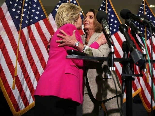Democratic U.S. presidential hopeful and former U.S. Secretary of State Hillary Clinton (L) hugs Hosue Minority Leader Rep. Nancy Pelosi (D-CA) (R) as they speak to members of the media July 14, 2015 on Capitol Hill in Washington, DC.