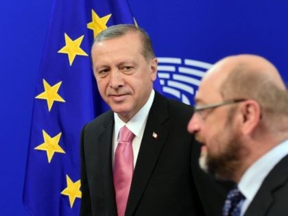 Turkey's President Recep Tayyip Erdogan (L) looks at European Parliament President Ma