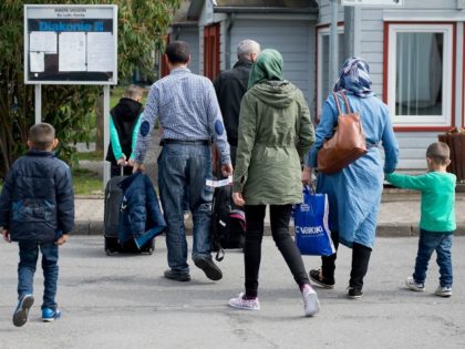 Refugees from Syria arrive at the Friedland shelter near Goettingen, central Germany, on April 4, 2016, after arriving from Turkey at the airport in Hanover. The first Syrians arrived in Germany from Istanbul under a controversial EU-Turkey migrant pact. / AFP / dpa / Swen Pfoertner / Germany OUT (Photo …