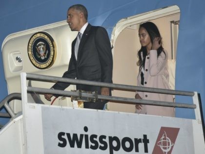 resident Barack Obama and his daughter Malia step off Air Force One upon arrival at Los An