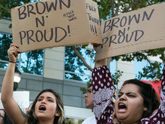 SAN JOSE, CA - JUNE 02: Protesters hold up signs that say "Brown n' Proud"