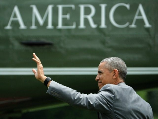 U.S. President Barack Obama walks across the South Lawn before boarding Marine One and dep