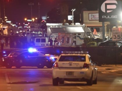 Lights from police vehicles light up the scene infront of the Pulse club in Orlando, Flori