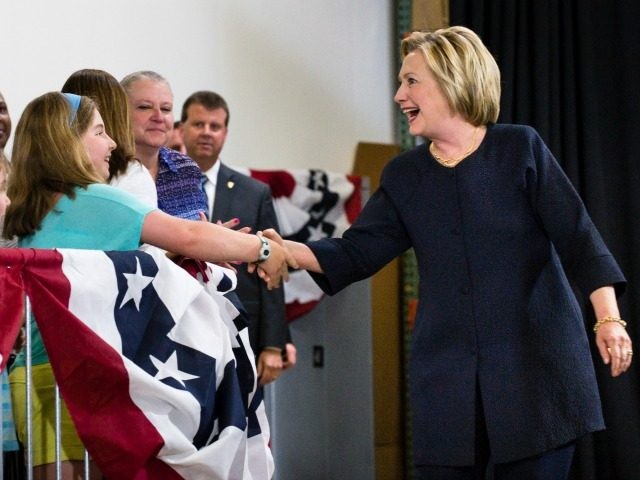 Democratic presidential candidate Hillary Clinton shakes hands with a young girl during a campaign stop at the Cleveland Industrial Innovation Center on June 13, 2016 in Cleveland, Ohio. In the wake of the shooting in Orlando, Florida, Clinton is campaigning in Ohio and Pennsylvania to present her vision for a …
