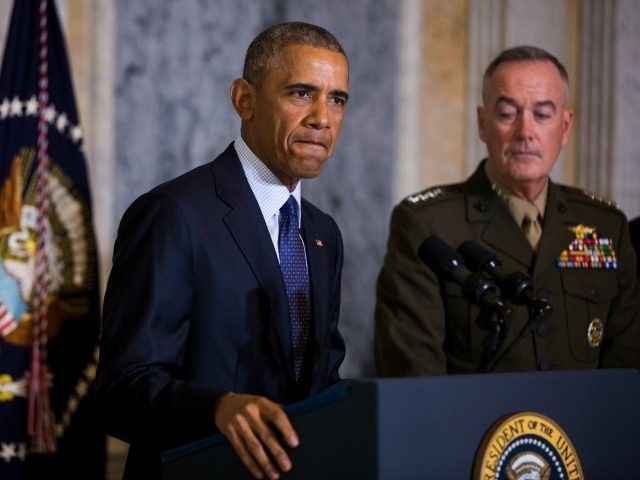 President Barack Obama (L) speaks on the Orlando shooting at the Treasury Department while Chairman of the Joint Chiefs of Staff General Joseph Dunford (R) look on, on June 14, 2016 in Washington, DC.