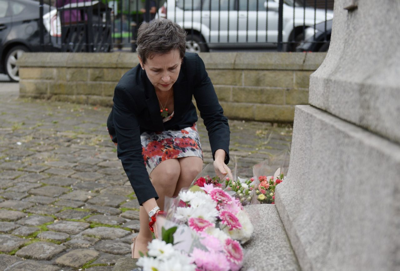 Labour MP Mary Creagh lays flowers at a statue to Joseph Priestly in Birstall near to the scene where Labour MP Jo Cox was shot on June 16, 2016. A British lawmaker died today after a shock daylight street attack, throwing campaigning for the referendum on Britain's membership of the European Union into disarray just a week before the crucial vote. / AFP / OLI SCARFF (Photo credit should read OLI SCARFF/AFP/Getty Images)