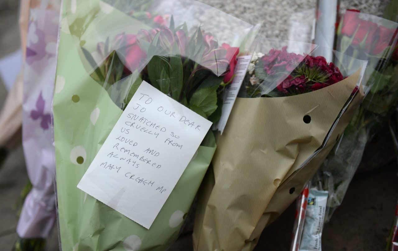 A note and flowers left by Labour MP Mary Creagh join bouquets at a statue to Joseph Priestly in Birstall near to the scene where Labour MP Jo Cox was shot on June 16, 2016. A British lawmaker died today after a shock daylight street attack, throwing campaigning for the referendum on Britain's membership of the European Union into disarray just a week before the crucial vote. / AFP / OLI SCARFF (Photo credit should read OLI SCARFF/AFP/Getty Images)