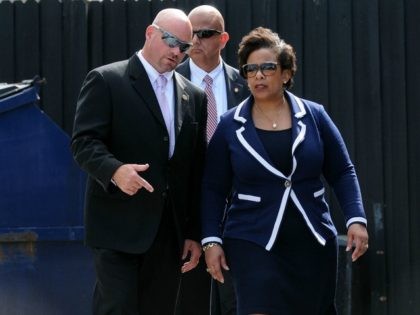 Attorney General Loretta Lynch (R) and FBI agent Ronald Hopper visit the Pulse nightclub c