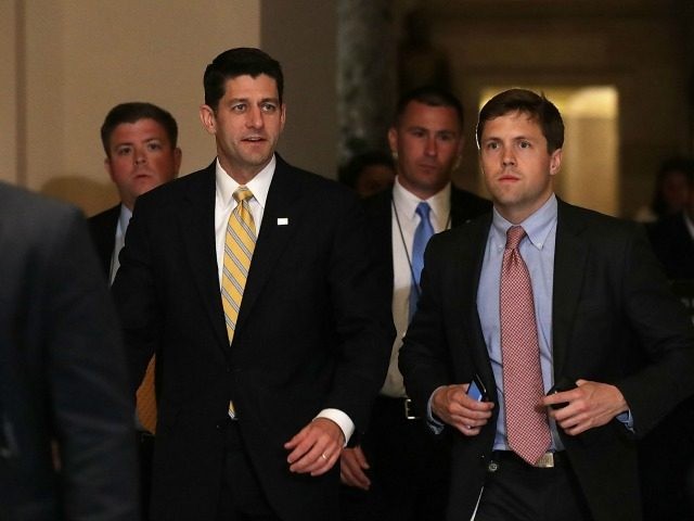 Speaker of the House Rep. Paul Ryan (R-WI) (C) arrives for votes as House Democrats stages