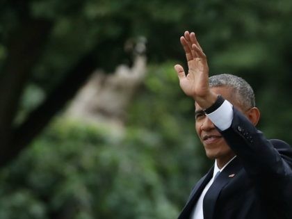 President Barack Obama waves as he walks toward Marine One while departing from the South