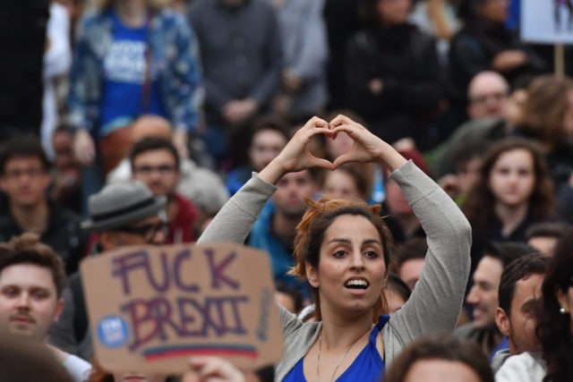 LONDON, ENGLAND - JUNE 28: (EDITORS NOTE: Image contains profanity.) Protesters gather ag