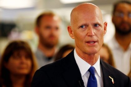 Florida Gov. Rick Scott speaks at NeoGenomics Laboratories, a cancer research company, in Fort Myers, Fla., on Monday, May 11, 2015. Scott came to talk about job growth, award Chairman and CEO Douglas VanOort with the Governor's Business Ambassador Award, and highlight a Naples-raised resident and technician with the company, …