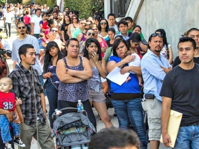 Immigrants line up for delayed deport and work permits.