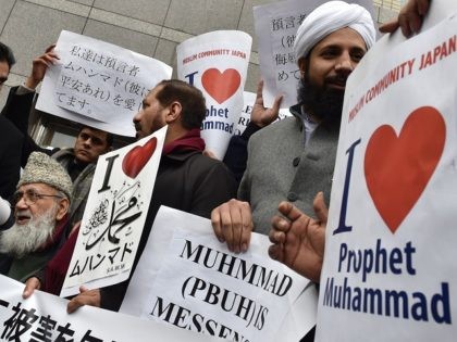 Muslims living in Japan stage a demonstration near the offices of Japanese publishing comp