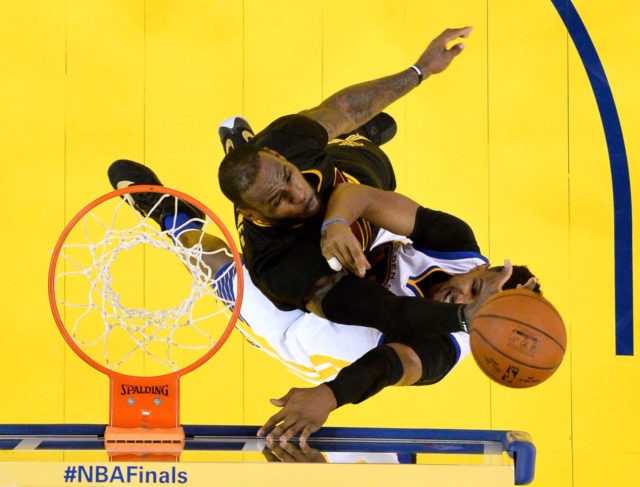 OAKLAND, CA - JUNE 19: LeBron James #23 of the Cleveland Cavaliers blocks a shot by Steph
