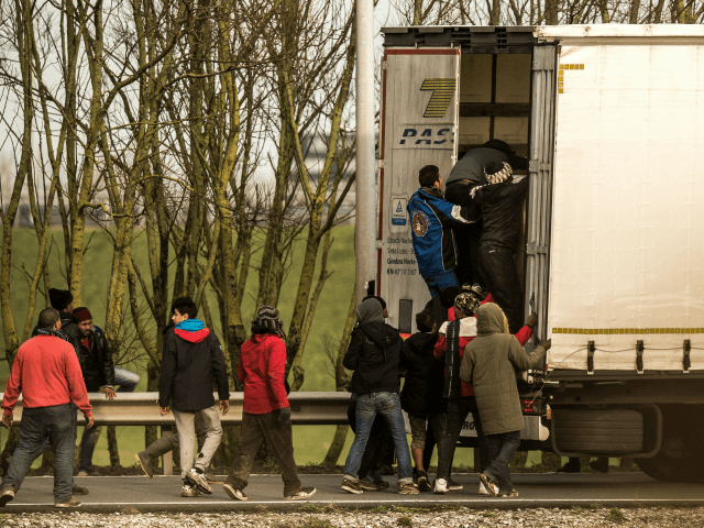Migrants attempting to break into a lorry