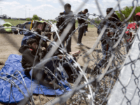 Migrants wait to enter the Hungarian transit zone nearby the motorway border crossing of Roszke between Hungary and Serbia Getty mass migration