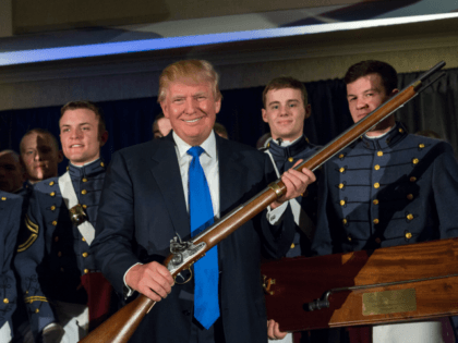 Reality TV host and New York real estate mogul Donald Trump holds up a replica flintlock rifle awar