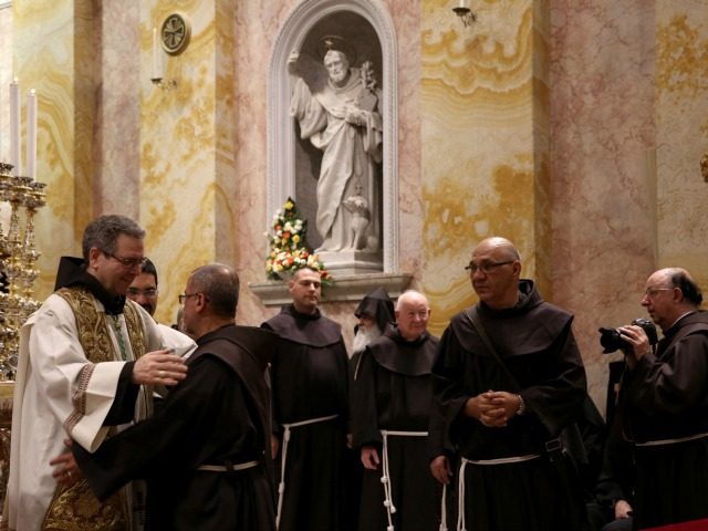 The newly elected Custodian of the Holy Land Friar Francesco Patton is greeted by fellow f