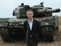 Secretary General Jens Stoltenberg stands in front of a Leopard tank of the Polish Army while speaking to the media during the NATO Noble Jump military exercises Getty Russia