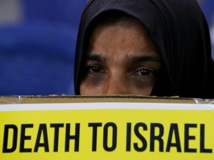 An Indian Muslim Shia devotee takes part in a demonstration against Israel during an event